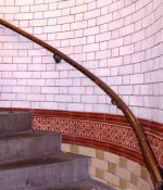 Staircase in Leeds City Markets with white glazed bricks and decorative tiles