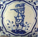 Early 17th century Dutch tile with a soldier playing on a flute