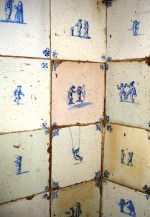 Detail of the fireplace in the Mustard Pot with 17th and 18th century Dutch tiles depicting children's games