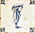 Mid 17th century Dutch tile with a soldier and fleur-de-lis corner motifs