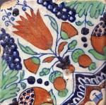 Early 17th century polychrome  Dutch tile with a complex motif of a tulip, marigolds, grapes and pomegranates