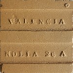 The reverse of a dust-pressed unglazed Nolla floor tile measuring 5 x 5 cm.